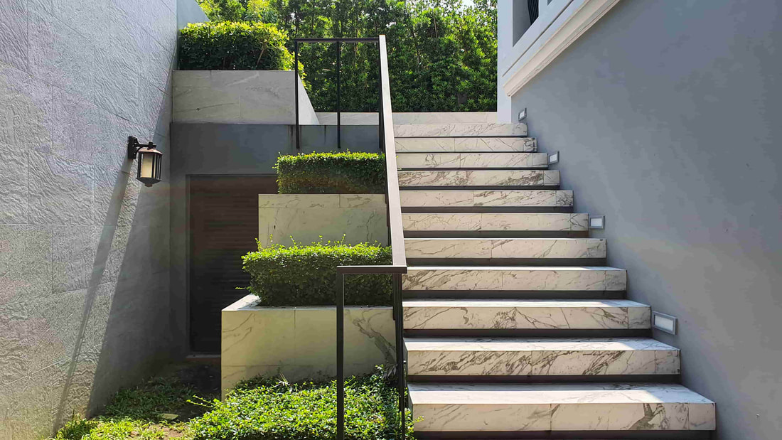 We installed concrete steps that look like concrete for one of our clients in Richmond. We added concrete retaining walls to the side as well.